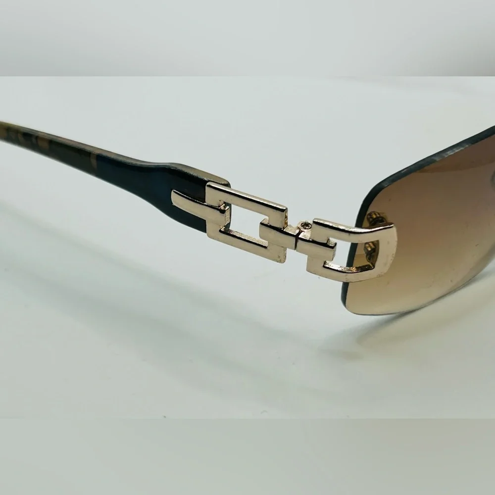 Vintage 90s Y2K Foster Grant Rimless gold link accent Sunglasses